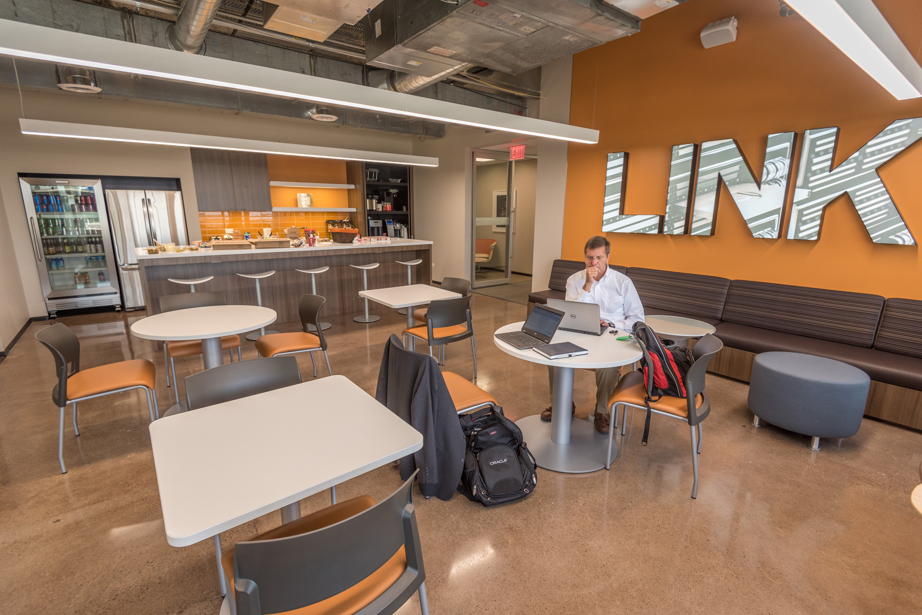 Cafeteria space in the workplace with company branding