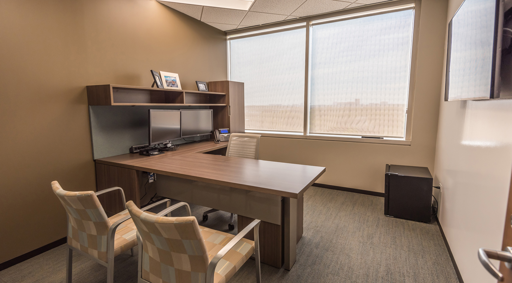 Custom private office desk, storage, and guest chair