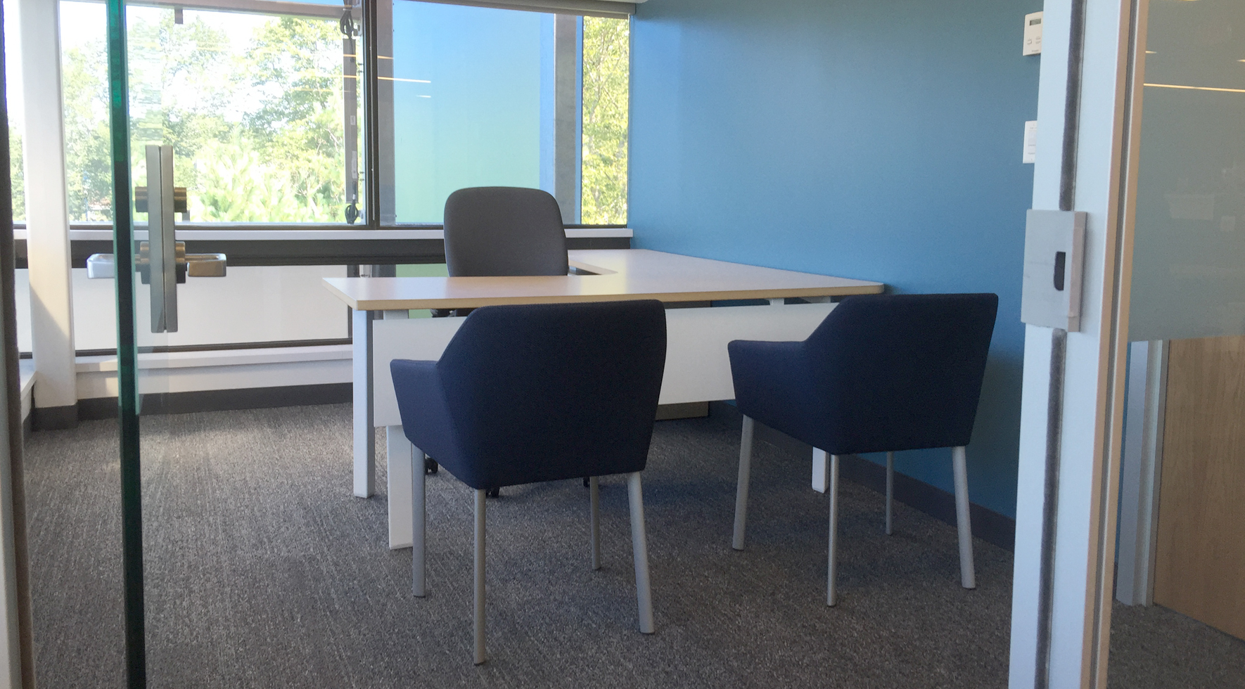 Private office desk and guest chairs