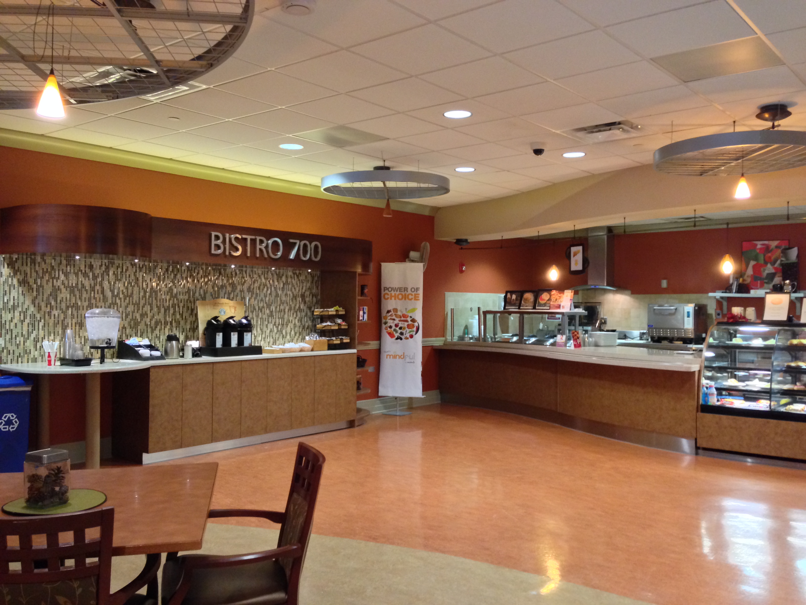 The cafe space promotes comfort and well-being in a healthcare facility