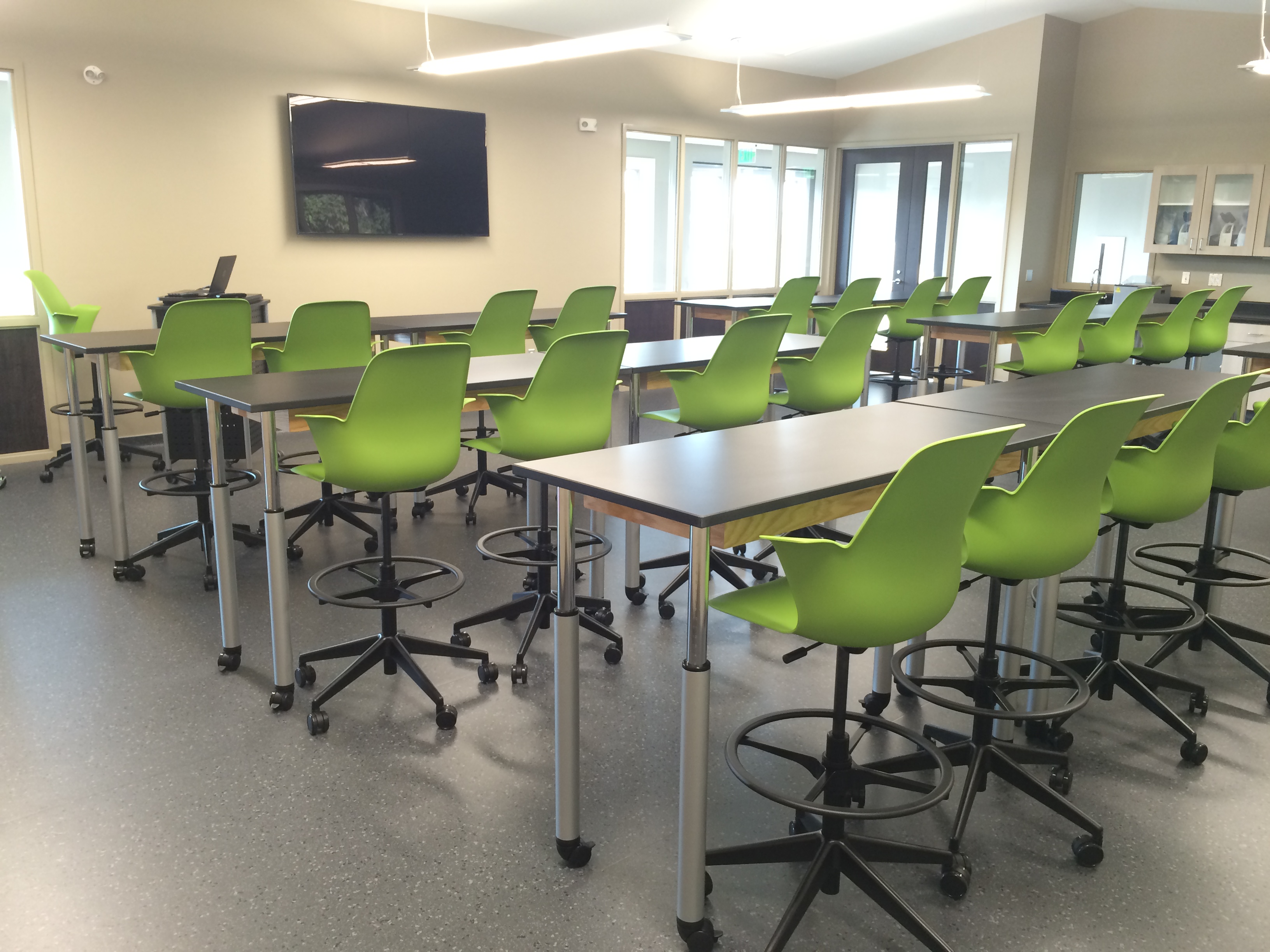 Integrated technology with chairs and tables in a classroom
